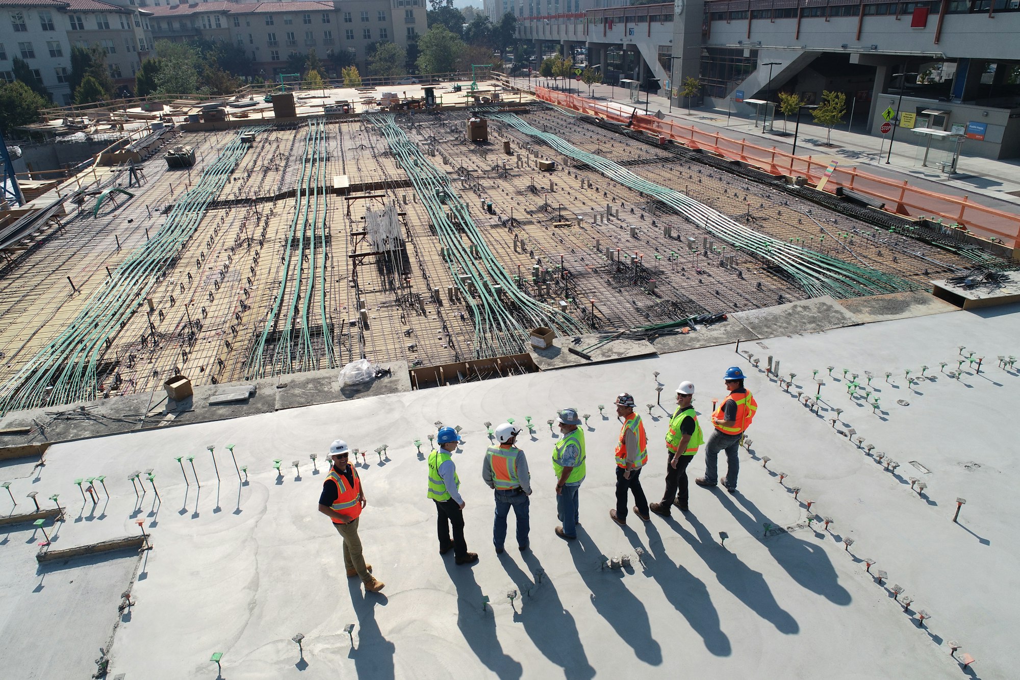 Reinforced concrete floor slab under construction with the site team at work